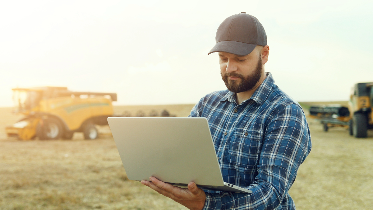 News featured image-2-Man with laptop on the field