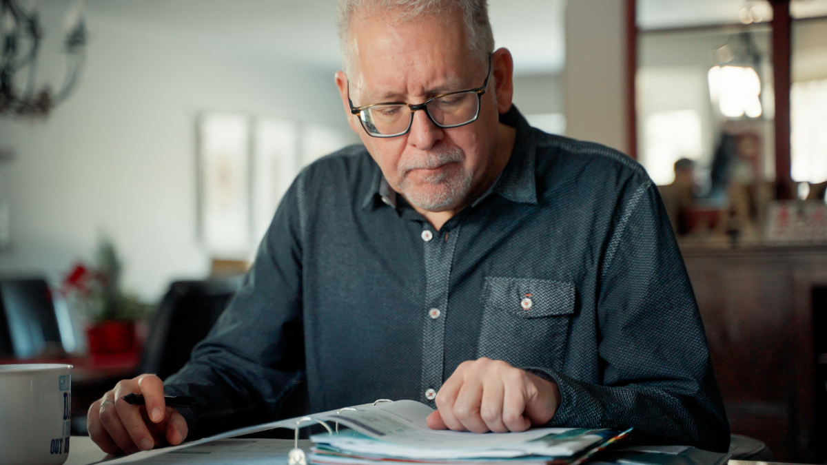 CSS member reading from booklet